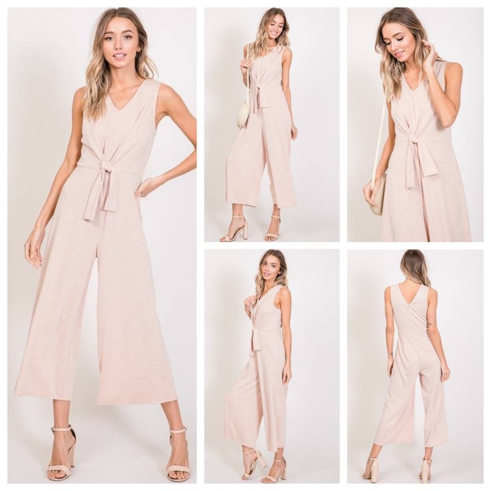 Sleeveless, cropped front knot jumpsuit in pink.